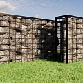 Building Exterior Wall with Gabion Black Metal Frame Natural Stones Green Grass Blue Sky