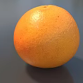 Fresh Ripe Grapefruit With Bright Orange Smooth Textured Skin On Gray Background