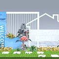 Floral Display Welcome Home Entrance Featuring White House Outline Flamingo Statues Green Plants And Flowers
