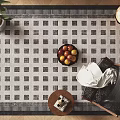 Square Rug With Modern Grid Pattern In Living Room With Chair Small Table And Plant Decor
