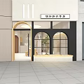 Designer Clothing Store Exterior With Arched Windows And Green Plant