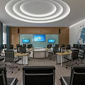 Modern Conference Room With Circular Meeting Table Multiple Screens And World Map Wall