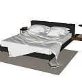 Double Bed With Black Headboard White Sheets Pillows Nightstand And Books On Rug