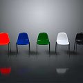 Modern Various Colored Chairs With Metal Legs On Grey Reflective Floor