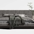 Modern Gray Double Bed With Soft Blanket Headboard And Potted Plant