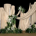 Elegant Floral Installation Featuring Beige Drapes White Flowers And Lush Greenery