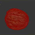 Whole Fresh Walnut With Yellowish Brown Wrinkled Surface On Gray Background