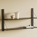 Black Floating Wall Shelves Displaying Vase Bowl Book And Box On Beige Wall