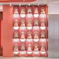 Family Dessert Shop Interior With Pink White Decor Display Cases And Fresh Bread