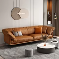 Modern Brown Leather Sofa Round Coffee Table Set With Orange Gray Pillows Wall Decor Rug