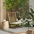 Wooden Leisure Chair With Stump Side Table Surrounded By Green Plants White Flowers And Bamboo