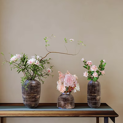 Textured Dark Vases With Pink White Flowers And Green Foliage On Table Against Light Wall 3d model