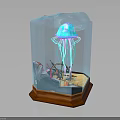 Vibrant Blue Jellyfish In Transparent Cube Container With Wooden Base And Underwater Decorations