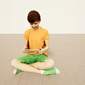 Boy Sitting Cross Legged On Floor Using Digital Tablet In Orange Shirt Green Shorts 3d model