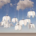 White Elephant Shaped Hanging Decorative Lights Against Blue Sky With Fluffy Clouds