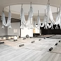 Spacious Modern Yoga Fitness Studio With Hanging Decorations Wooden Flooring And Yoga Mats