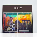 Vibrant Italy Themed Window Display With Colorful Landmarks Hexagonal Decorations And Orange Sunglasses