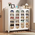 White Shoe Cabinet With Glass Doors Multiple Shelves And Decorative Items On Top
