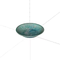 Elegant Turquoise Ceramic Plate With Intricate Carved Patterns On Black Background