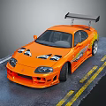 Orange Modified Sports Car Featuring Rear Spoiler Body Decals On Asphalt With Yellow Lines