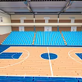 Indoor Basketball Gymnasium Interior With Wooden Court Blue Seats And Bleachers 3d model