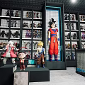 Anime Figurine Collection Display With Shelves And Various Character Models