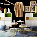 Modern Decorative Cabinet Scene With Hanging Coat Vase Flowers Framed Artworks Small Tables And Colorful Rug