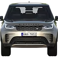 Silver Land Rover Discovery SUV With Headlights And License Plate