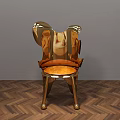 Golden Modern Accent Chair With Unique Shape On Herringbone Wooden Floor