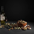 Bowl Of Delicious Mixed Nuts And Chocolate With Wine Bottle And Glasses