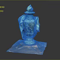 Turquoise Vase Shaped Sculpture Carving with Figural Details and Transparent Base on Black Background