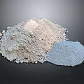 Different Colored Powder Building Materials in Piles on Dark Background