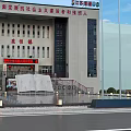 Scenic Square Landscape With Central Fountain Pool Red Flags On Flagpoles And Paved Ground