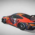 Porsche Race Car With Orange And Blue Camouflage Design And Rear Spoiler