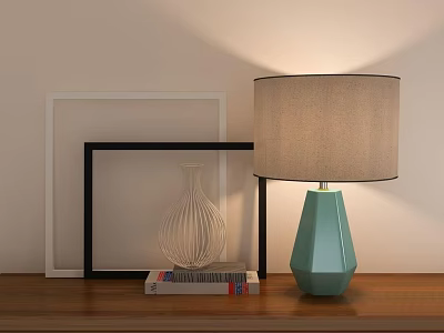Teal Geometric Table Lamp With Beige Fabric Shade On Wooden Table Near Picture Frames 3d model