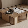 Wooden Coffee Table with Woven Details Tray Cup Open Book in Modern Living Room