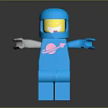 Blue Lego Astronaut In Blue Spacesuit With Pink Planet Graphic Yellow Face And Outstretched Hands