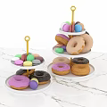 Two Tiered Dessert Stands With Colorful Donuts And Macarons On Marble Countertop