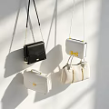 Stylish Black And White Handbags With Crossbody Straps And Structured Designs