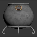 Metallic Cauldron With Three Legs And Brass Handles On Black Reflective Surface
