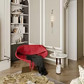 Red Accent Chair With Black Blanket Near Marble Side Table And Bookshelf In Modern Interior