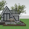 Wooden House With Triangular Green Roof Glass Railed Balcony Deck And Lawn Surrounded By Trees