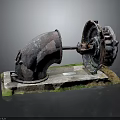 Old Rusted Electronic Device Parts Displayed on Mossy Industrial Base Stand