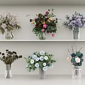 Different Types of Beautiful Colorful Flower Vases With Assorted Floral Blooms On Display Shelves