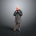 Bald Man Adjusting Collar Of Dark Coat Standing Against Gray Background