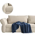 Beige Three Seater Sofa With Blue Throw Blanket And Black Sofa With Pink Throw