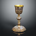 Decorative Golden Silver Chalice With Intricate Carvings And Ornate Base