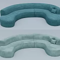 Curved Multi Person Sofa In Soft Blue Green And Light Green With Matching Cushions