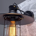 Industrial Black Metal Wall Light With Glass Shade And Vintage Filament Bulb On Gray Wall