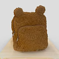 Brown Fluffy Backpack With Ear Shaped Decorations And Zipper Pocket On Wooden Board